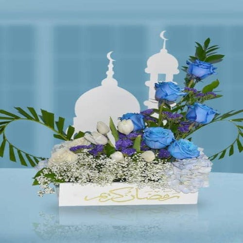 Ramadan Kareem Floral Gift": Wooden box filled with vibrant flowers, showcasing elegance.