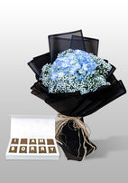 Blue hydrangea bouquet with chocolates, perfect for an apology gift in UAE.