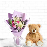 Roses, lilies, and teddy bear gift set UAE