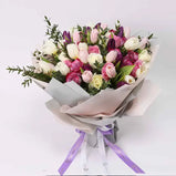 Grand rose and tulip bouquet with mixed colors (white, pink, purple) and Ferrero Rocher chocolates.