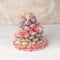 Three-tiered tower of chocolate-dipped strawberries and pink roses, a stunning Valentine's Day gift