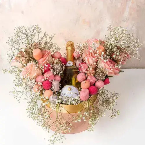 A non-alcoholic gift hamper with roses, chocolates, and sparkling wine (giftshop.ae)