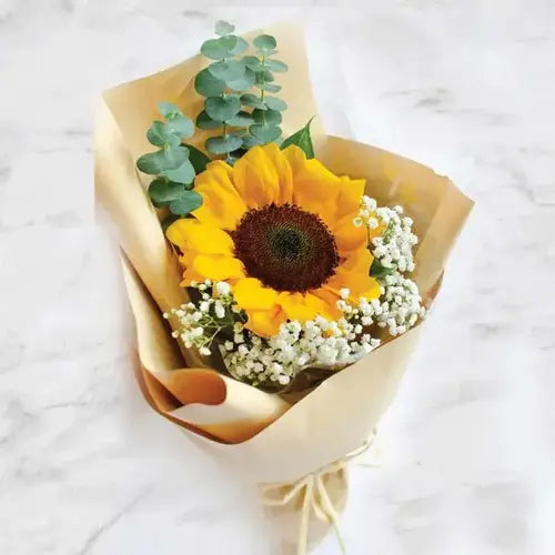 Brighten someone's day with a sunflower bouquet and triple chocolate cake. Perfect for any occasion. Same-day delivery in UAE.