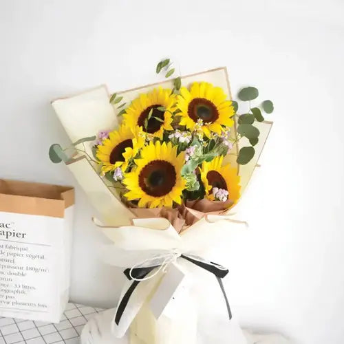 Brighten Up Smile: Fresh Sunflower Bouquet with Pink Statice & Eucalyptus Leaves: Flower Delivery in UAE