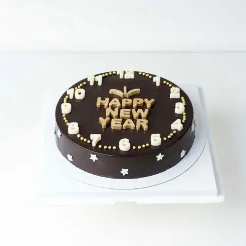 Happy New Year chocolate cake with assorted truffles, perfect for gifting in celebration.