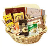 a beautifully presented A Taste of Arabia Gourmet Gift Basket, filled with dates, chocolates, nuts, cheese, and other treats
