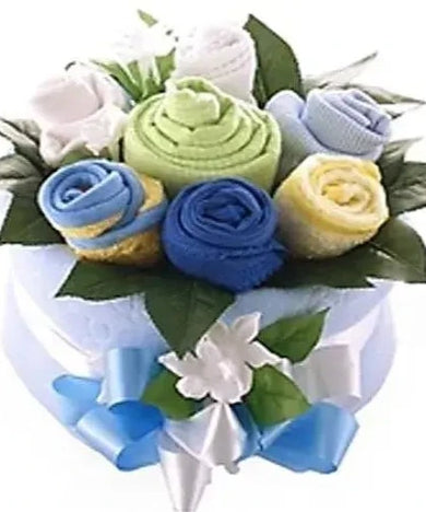 Baby boy gift bouquet with romper suits, bib, towel, bonnet, sleep suit, blanket, greenery, and flowers. 