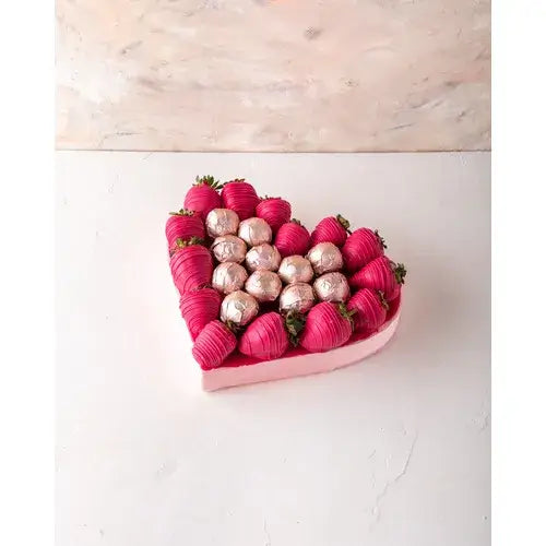 Gift box with fuchsia chocolate strawberries and assorted truffles (Chocolate Gift Delivery Dubai - giftshop.ae).