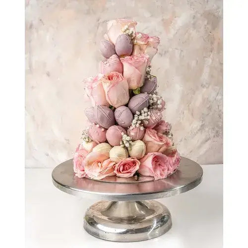 Tower arrangement with chocolate dipped strawberries in white, pink, and purple, pink roses, and baby's breath (Indulge & Delight: Chocolate Strawberries & Roses Tower - giftshop.ae)