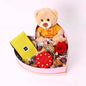 Preserved red rose, Patchi chocolates, love-scented candle, "You Are Amazing" teddy bear in heart box.