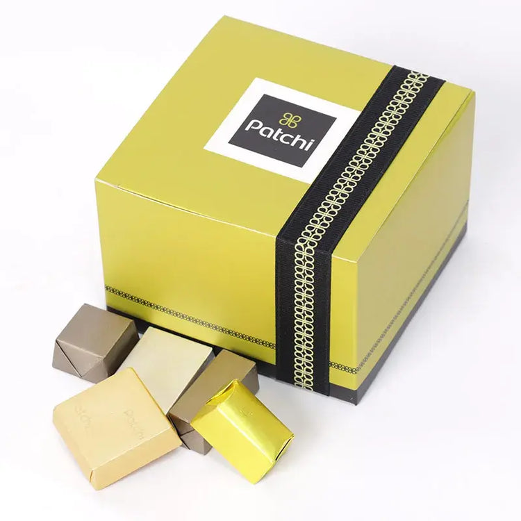 Showcase a box of Deluxe Patchi Chocolates (250gm) featuring an assortment of milk and dark chocolates. Highlight the elegant packaging.