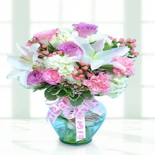 This beautiful bouquet of flowers is the perfect way to celebrate the arrival of a new baby girl.