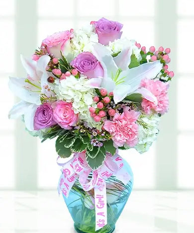 This beautiful bouquet of flowers is the perfect way to celebrate the arrival of a new baby girl.