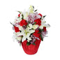 Red vase flower arrangement with lilies, carnations, and lisianthus.