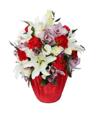 Red vase flower arrangement with lilies, carnations, and lisianthus.