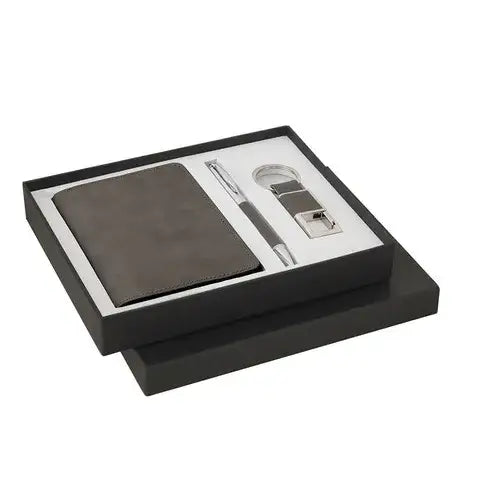 Gift box containing black passport holder, metal pen, and metal keychain (PINTIM Travel Gift Set Dubai - giftshop.ae)