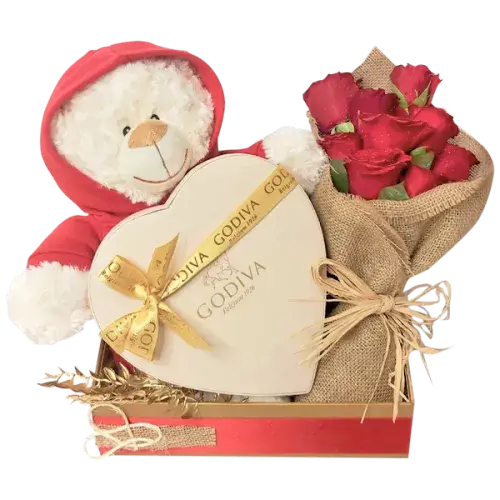 Gift set with Godiva chocolate box, red rose bouquet, and cream teddy bear with "I Love You" message.