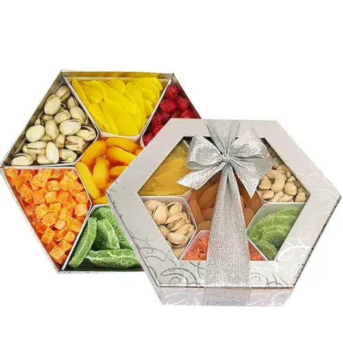 A photo of a stylish hexagonal gift box overflowing with a colorful assortment of dried fruits and premium nuts.