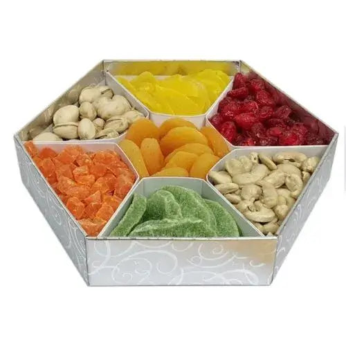 A photo of a stylish hexagonal gift box overflowing with a colorful assortment of dried fruits and premium nuts.