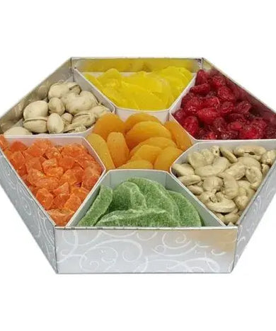 A photo of a stylish hexagonal gift box overflowing with a colorful assortment of dried fruits and premium nuts.