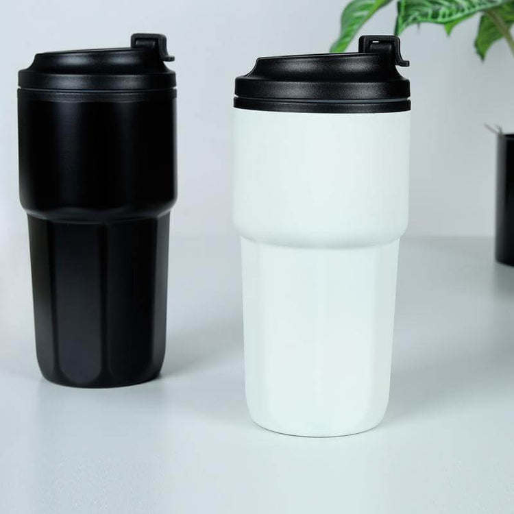 "Kavala: Durable & Stylish Travel Mug": Showcase the travel mug in a sleek and professional setting, highlighting its design and size
