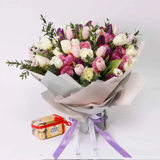 Grand rose and tulip bouquet with mixed colors (white, pink, purple) and Ferrero Rocher chocolates.