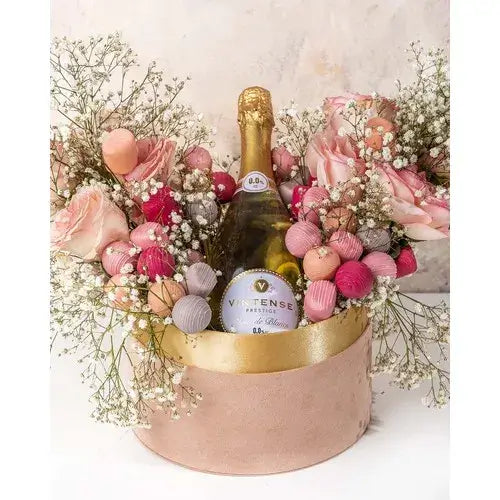 Non-alcoholic gift hamper with roses, chocolates, and sparkling wine (giftshop.ae)