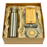  Eco-friendly office gift set featuring a stainless steel flask, wireless charging stand, and Bluetooth speaker, all made with bamboo and cement materials.