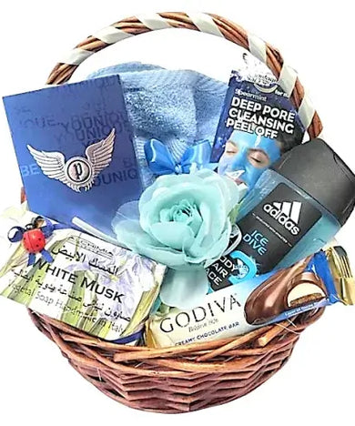 a beautifully wrapped Men's Rejuvenation Gift Hamper with shower gel, handmade soap, face mask, cologne, chocolate bar, and hand towels