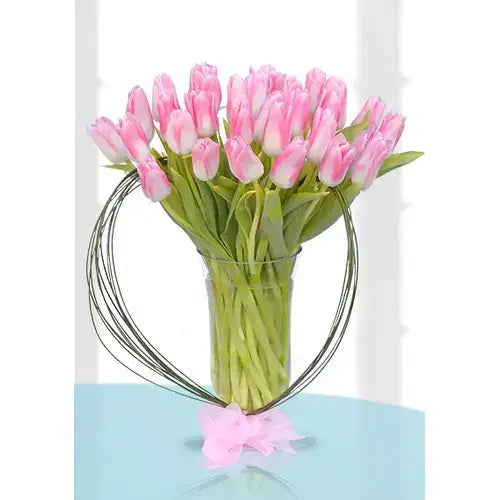 30 pink tulips arranged in a chic vase (Speak Volumes with Pink Tulips - giftshop.ae)