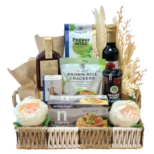 a beautifully wrapped cellophane basket filled with a variety of organic gourmet treats, teas, and healthy snacks, perfect for a Ramadan gift