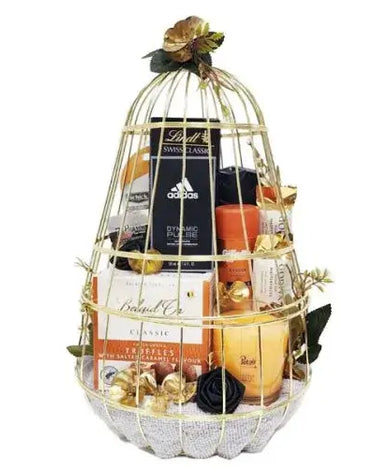 Gift basket with men's grooming products, chocolates, candle, and towels. Gift wrapped with cellophane and ribbons