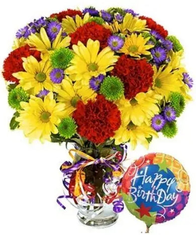 Birthday flower bouquet with red carnations, yellow daisies, purple eustoma, and green button poms, with a birthday balloon.