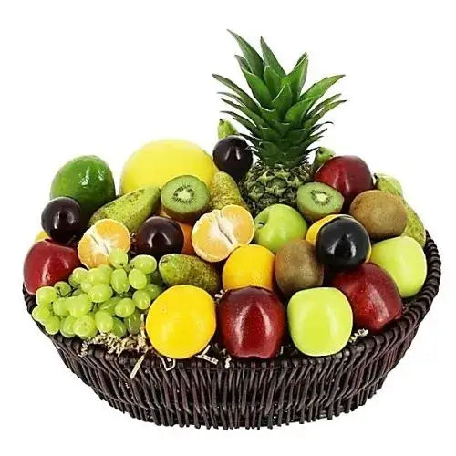 A photo of a large wicker basket overflowing with a colorful assortment of seasonal and exotic fruits, including avocado, longan, Asian pears, persimmons, and satsumas