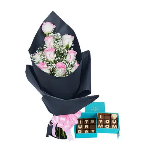 Gift basket with pink roses, chocolates, and black wrapping (Mother's Day Gifts Dubai - giftshop.ae).