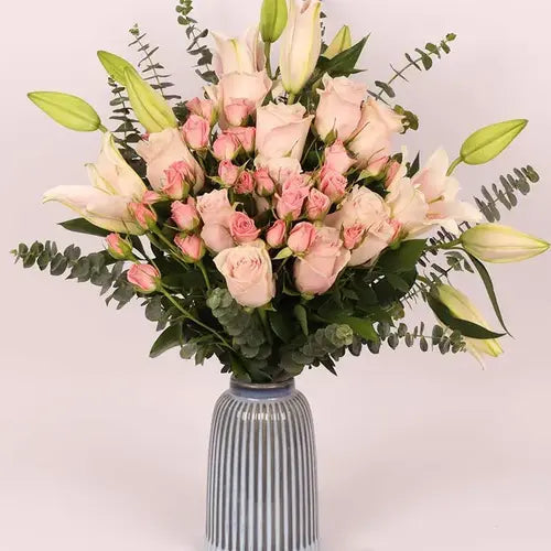 Send a gift of pink flowers! Pink lilies, roses & eucalyptus delivered fresh across UAE.