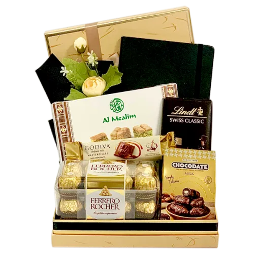 The Executive Gift Basket with chocolates, Arabian sweets, notebook, wrapped in cellophane with ribbons and bows.