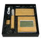 Black gift box containing bamboo wireless power bank, desk clock, pen with case, and metal keychain.