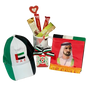 Gift bag with UAE National Day colors containing chocolates, mug, cap, and scarf (UAE National Day Hamper Dubai - giftshop.ae)