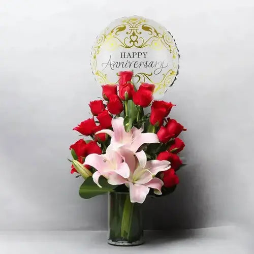 Anniversary bouquet with red roses, pink lilies, balloon & vase. Dubai flower delivery (UAE).