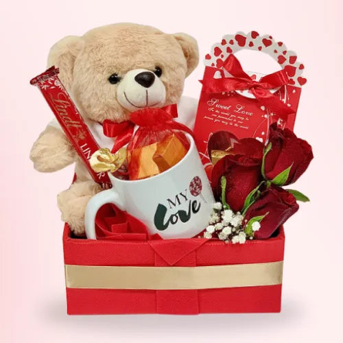 Gift box with soft teddy, chocolates, and red roses for girlfriend in Dubai, UAE