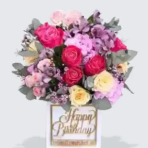 Elegant birthday flower bouquet with roses, pink hydrangea, and greenery in a charming vase, available online in UAE from Giftshop.ae