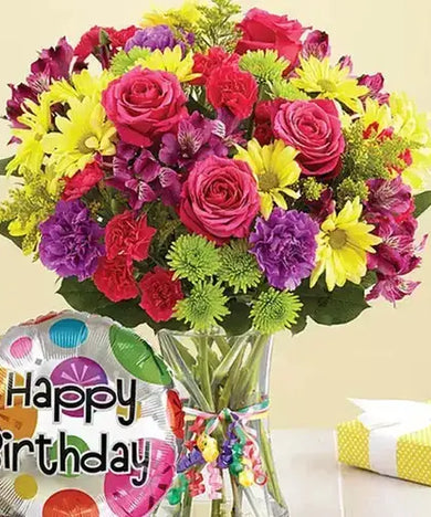 Celebrate a birthday with a bang! Colorful flowers, balloon & vase, delivered fresh across UAE.