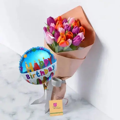 Celebrate a birthday with a bang! Colorful tulip bouquet with a balloon, delivered fresh across UAE.