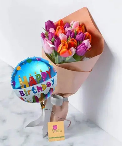 Celebrate a birthday with a bang! Colorful tulip bouquet with a balloon, delivered fresh across UAE.