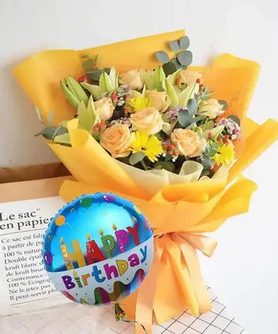 Celebrate a birthday in style! Colorful bouquet with peach roses, gerberas, lilies, balloon & gift wrap, delivered fresh across UAE.