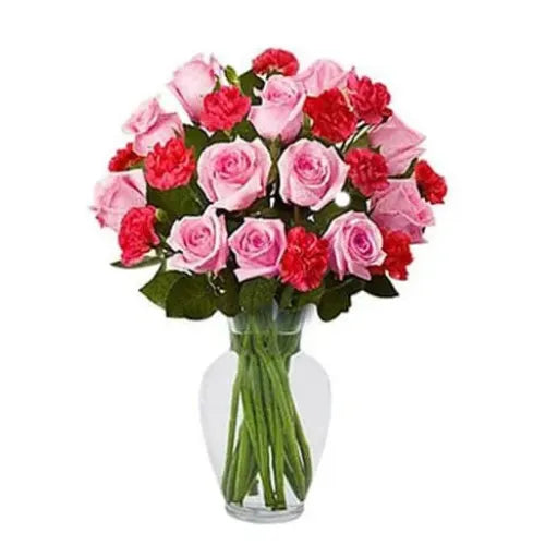 Carnation flower delivery in Dubai, UAE – Red and pink roses with carnations arranged in a beautiful vase.