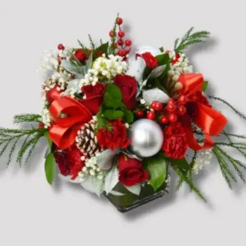 Christmas gift flower arrangement with red roses and carnations