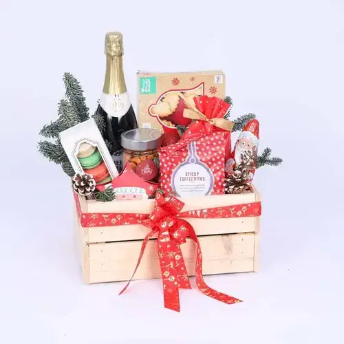 Emotion Christmas Gift Hamper with festive treats arranged in a wooden box.