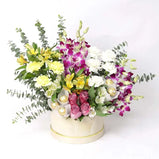 Vibrant flower arrangement with orchids, carnations, roses & Ferrero Rocher (Dubai delivery). Perfect gift!